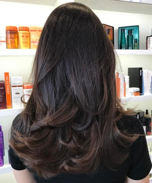 Armpit-Length Brown Hair with Curled Ends